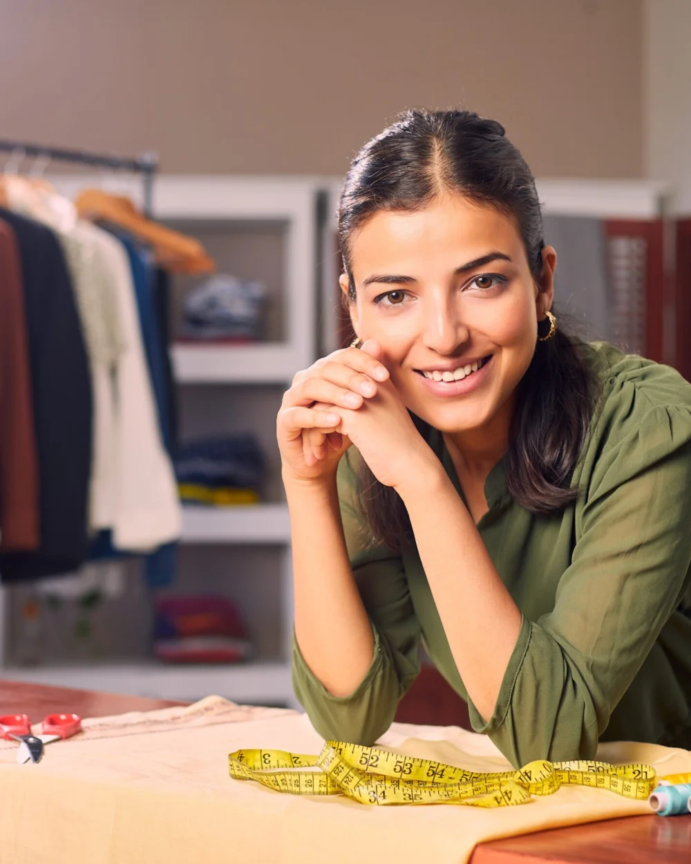 A self-employed boutique owner working in her studio
